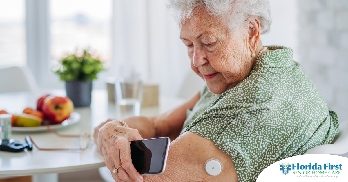 A senior woman uses her smartphone to check her glucose monitor, a tool that can be extremely helpful for diabetes care.