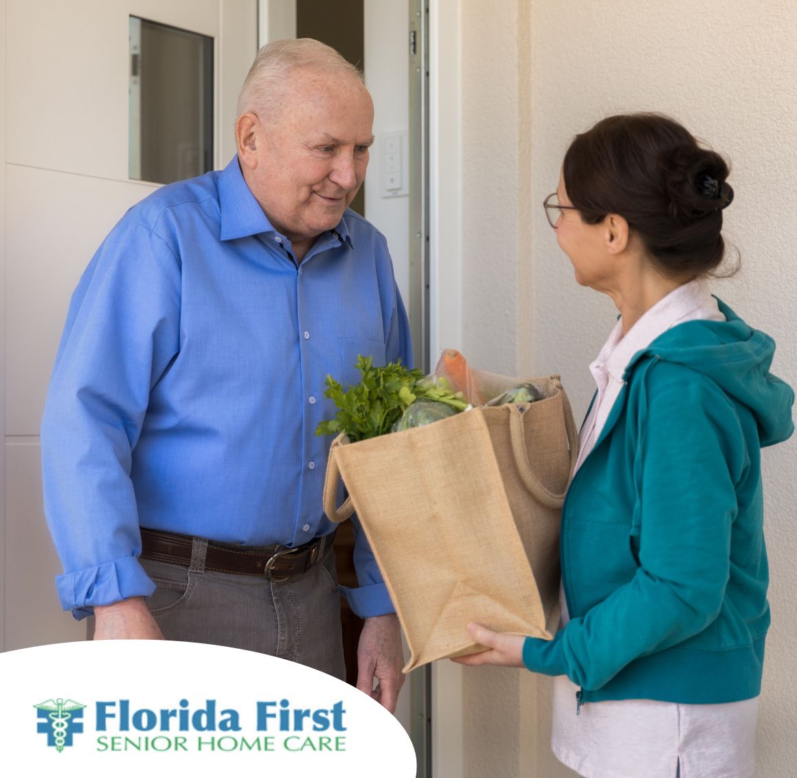 A caregiver gives groceries to a senior client, representing the light housework and errands that Florida First can help out with in Boca Raton.