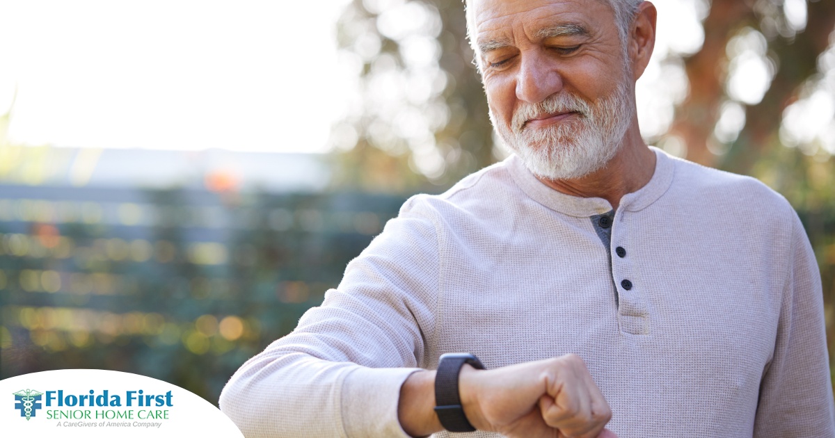 A senior man wears a smart watch, representing one of the many ways smart technology is shaping home health care.