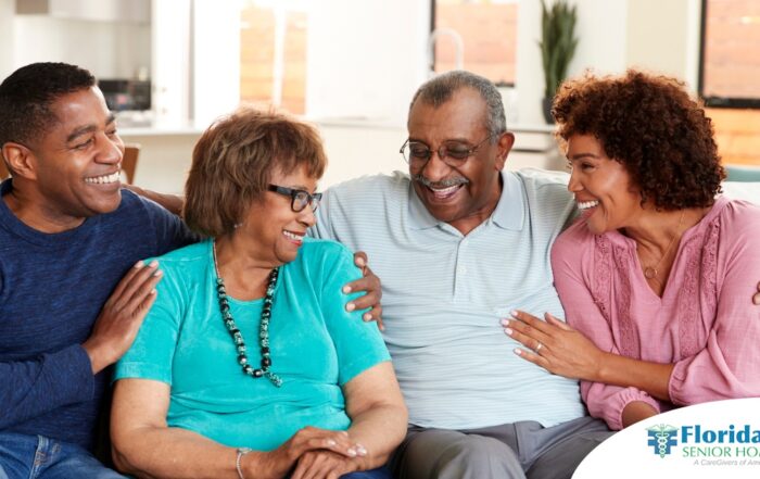 A couple sits with aging parents and enjoys their time together.